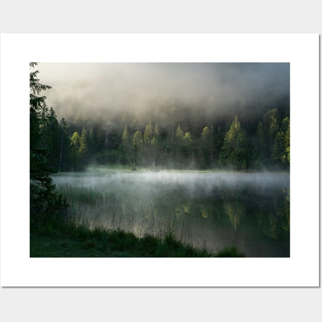 Magic Misty Lake. Amazing shot of a wooden house in the Ferchensee lake in Bavaria, Germany, in front of a mountain belonging to the Alps. Scenic foggy morning scenery at sunrise. Wall Art by EviRadauscher